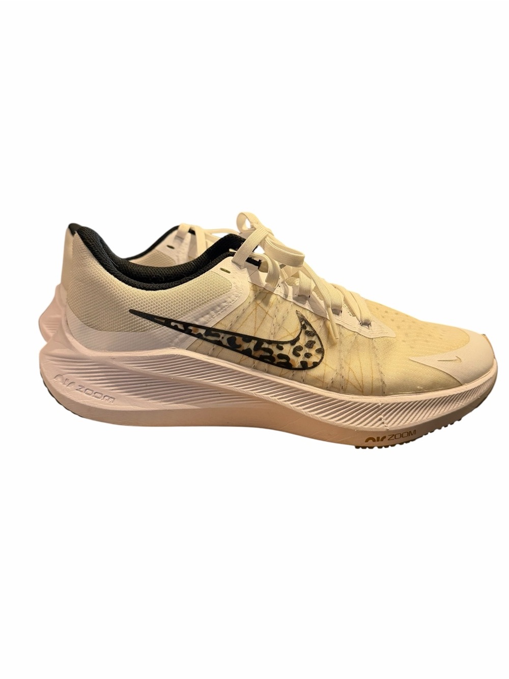 Nike Women’s Cream and Black Running Shoe with Leopard Swoosh